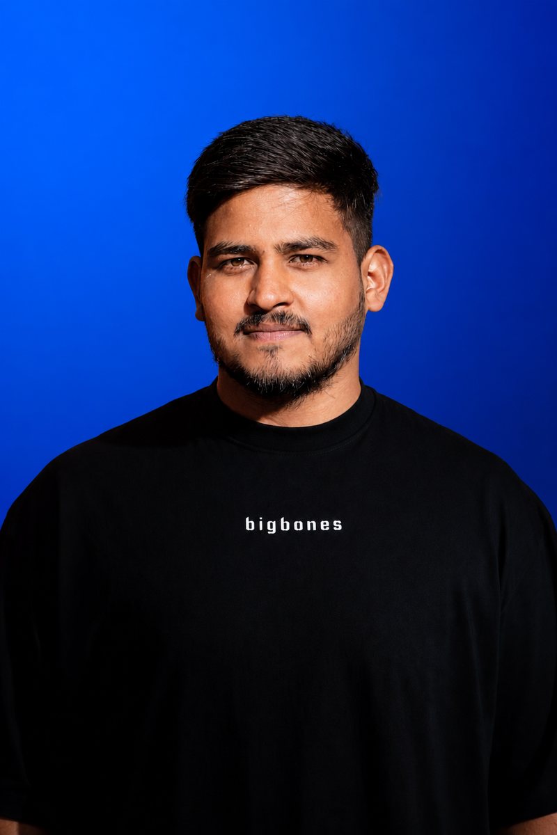 Zillionaire Honey, growth strategist for YouTube and Instagram creators, photographed against a blue backdrop.